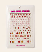 A sheet of nail art stickers in a clear plastic sleeve, featuring red and gold sports-themed stickers including footballs, helmets, players, and text such as 'ANY GIVEN FUNDAY' and team names on a white backing card.