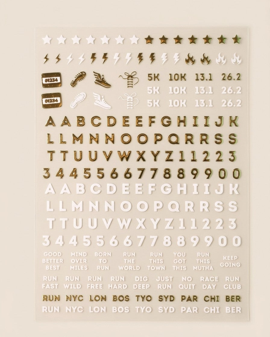 Running nail art sticker sheet: white and gold chrome letters, numbers, 5K 10K 13.1 26.2, shoes, bolts, and race-day phrases