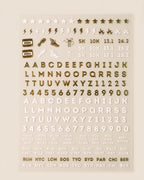 Running nail art sticker sheet: white and gold chrome letters, numbers, 5K 10K 13.1 26.2, shoes, bolts, and race-day phrases